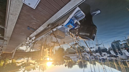 Moorea Sunrise Fishing boat moored at Vaiare Marina at sunrise