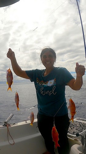 Young angler with her reef fish caught with a sabiki